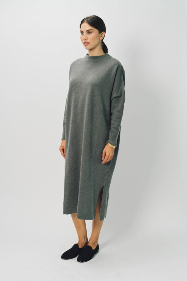 Side view of storm iconic cashmere dress on model wearing loafers, against a white background.