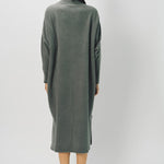 Back view of storm iconic cashmere dress on model wearing loafers, against a white background.
