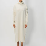 Front view of bone iconic cashmere dress on model wearing loafers, against a white background.