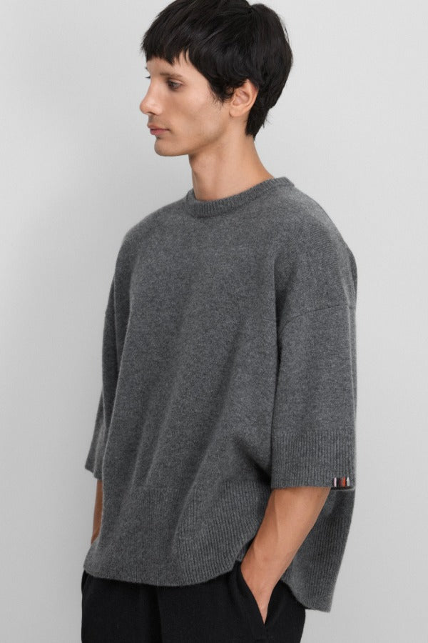 Front slanted view of felt no 433 sassie sweater on model wearing black pants, against a white background.
