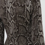 Back view of greyscale aalia dress on model, against a white background.