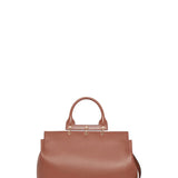 Front view of cognac amethyst tote showing strap on white background with no model showing
