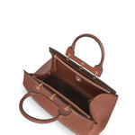 Side open view of cognac amethyst tote on white background with no model shown.