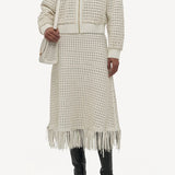 Front view of white odin bomber jacket on model wearing the white Bennie skirt and boots, against a white background.