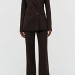 Front view of chocolate stephanie blazer on model wearing chocolate pants, against a white background.