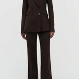 Front view of chocolate stephanie blazer on model wearing chocolate pants, against a white background.