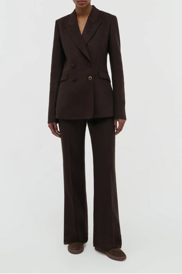 Front view of chocolate stephanie blazer on model wearing chocolate pants, against a white background.
