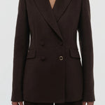 Front closeup view of chocolate stephanie blazer on model wearing chocolate pants, against a white background.