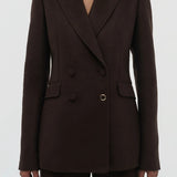 Front closeup view of chocolate stephanie blazer on model wearing chocolate pants, against a white background.