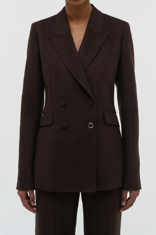 Front closeup view of chocolate stephanie blazer on model wearing chocolate pants, against a white background.