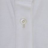 Front closeup view of white daphne polo shirt with no model shown.