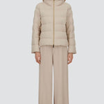 Front closed view of chantilly cape jacket on model wearing beige pants, against a white background.