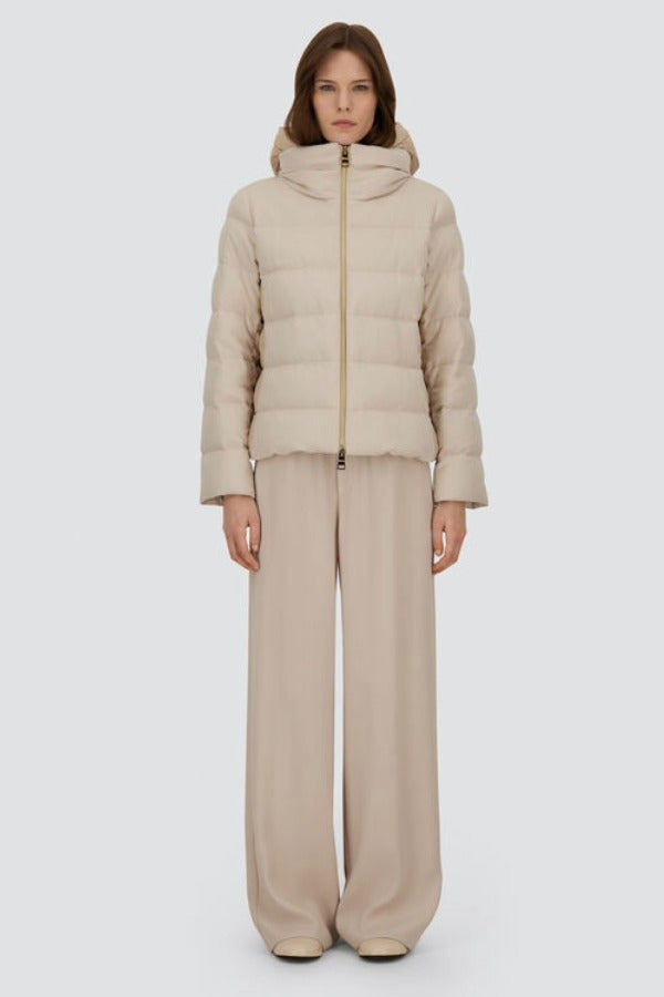 Front closed view of chantilly cape jacket on model wearing beige pants, against a white background.