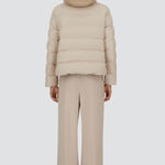 Back view of chantilly cape jacket on model wearing beige pants, against a white background.
