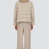 Back view of chantilly cape jacket on model wearing beige pants, against a white background.