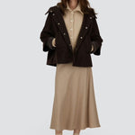 Front view of opened cape on model wearing chantilly dress and flats, against a white background.