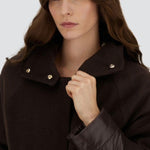 Front closeup view of fondante cape on model, against a white background.