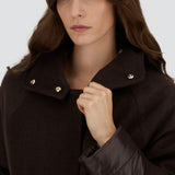 Front closeup view of fondante cape on model, against a white background.