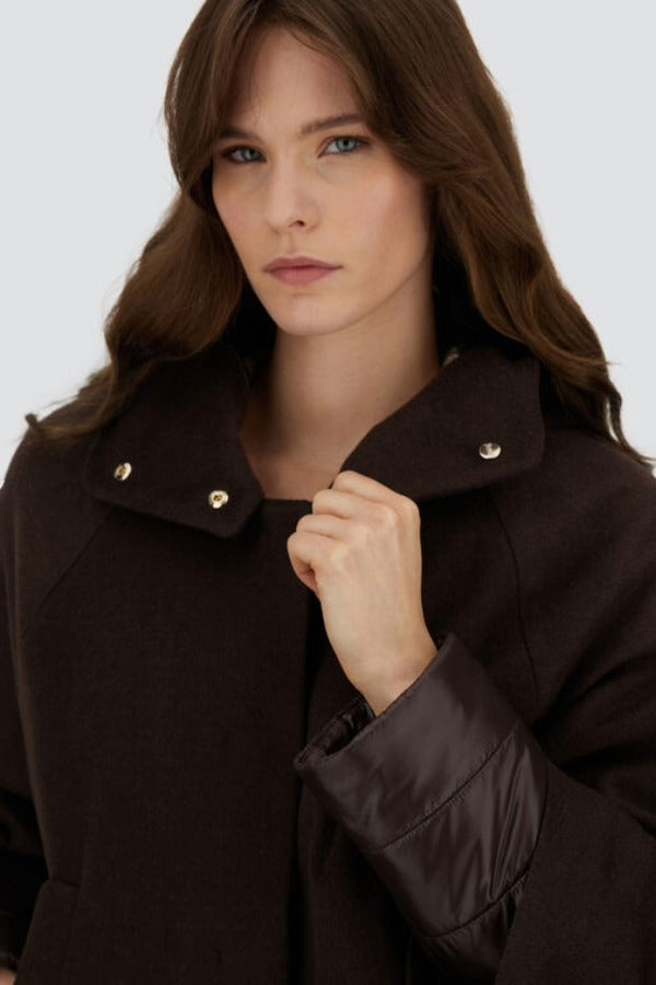 Front closeup view of fondante cape on model, against a white background.