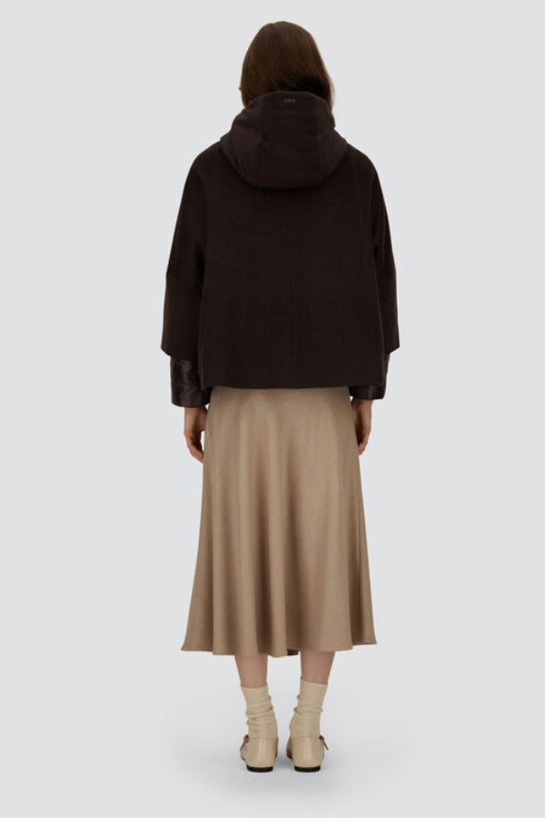 Back view of fondante cape on model wearing chantilly dress and flats, against a white background.