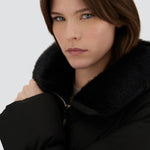 Front closeup view of black jacket in arendelle on model, against a white background.