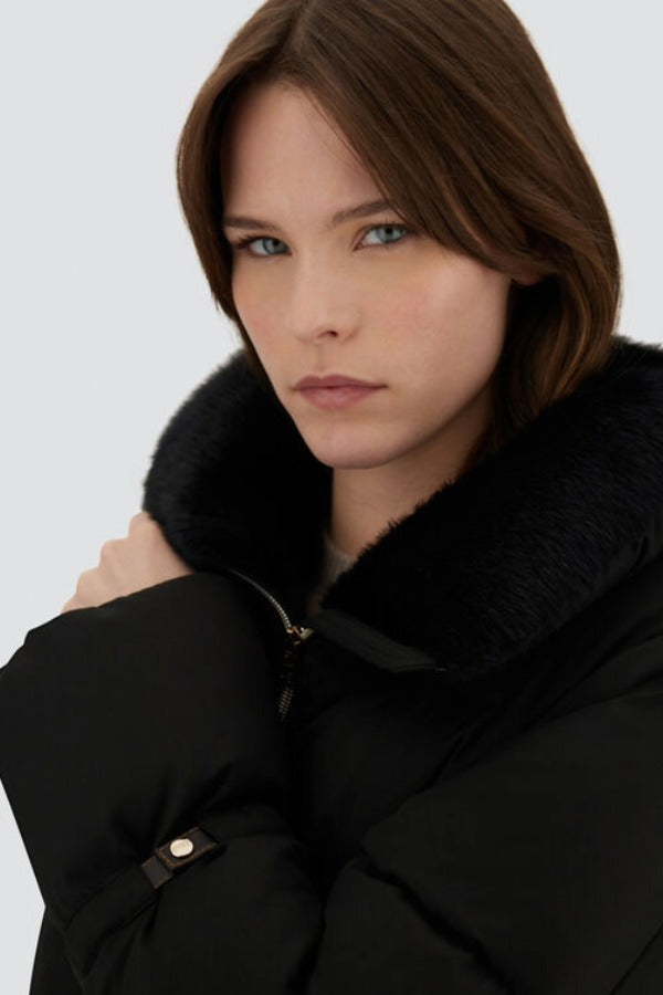 Front closeup view of black jacket in arendelle on model, against a white background.