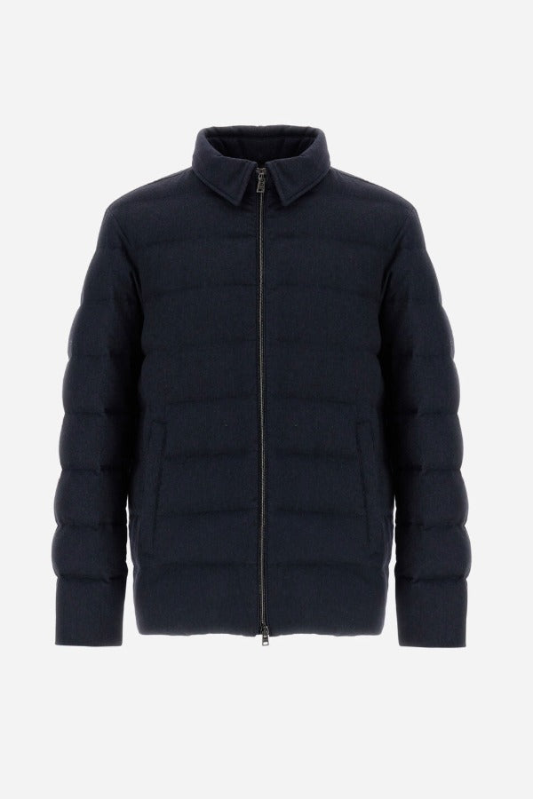 Front view of blue men's jacket on white background, with no model shown.