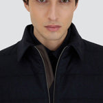 Front closeup view of blue men's jacket on model, against a white background.