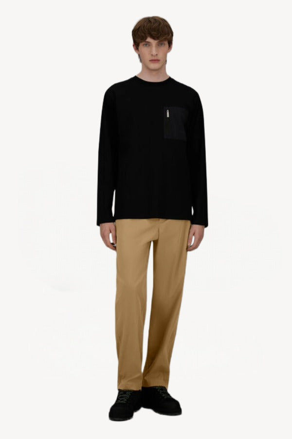 Front view of cammello laminar trousers on model wearing black t-shirt and sneakers, against a white background.