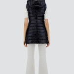 Back view of black serena vest on model wearing white t-shirt, pants and sneakers, against a white background.