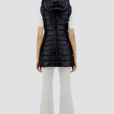 Back view of black serena vest on model wearing white t-shirt, pants and sneakers, against a white background.