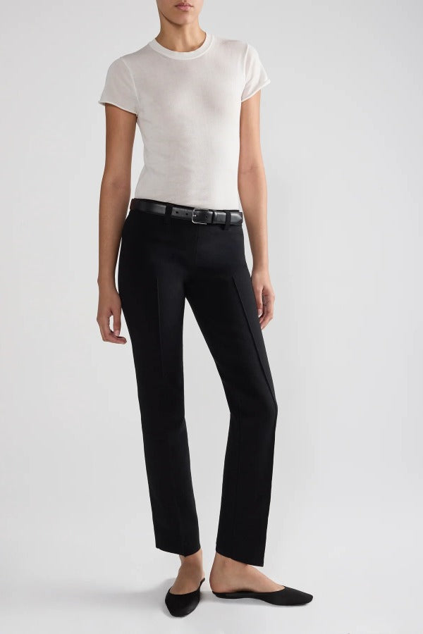 Front view of black tuxedo julep pant on model wearing white t-shirt and flats, against a white background.