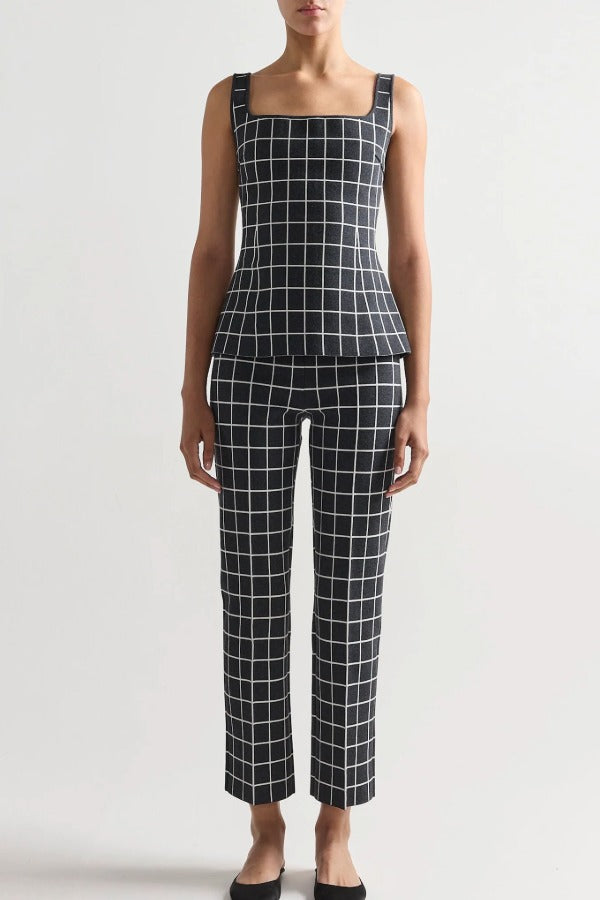 Front view of charcoal combo inna top on model wearing charcoal combo louis pants and flats, against a white background.