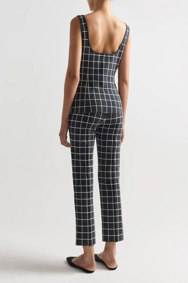 Back view of charcoal combo inna top on model wearing charcoal combo louis pants and flats, against a white background.