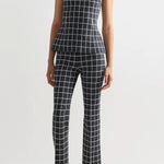 Alternate front view of charcoal combo inna top on model wearing charcoal combo louis pants and flats, against a white background.