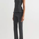 Side view of charcoal combo louis pants on model wearing charcoal combo inna top and flats, against a white background.