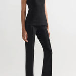 Alternate front slanted view of black combo windowpane inna top on model wearing black pants and flats, against a white background.