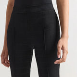 Front closeup of black combo windowpane louis pants on model wearing black t-shirt, against a white background.