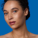 Front view of 18K YG 16" Necklace on model, against a blue background.