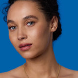 Front view of 18K YG 16" Necklace on model, against a blue background.