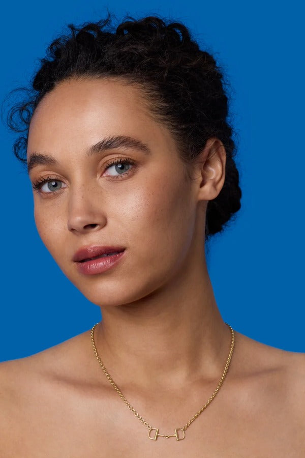 Front view of 18K YG 16" Necklace on model, against a blue background.
