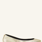 Left side view of gold ballerina flats on white background, with no model shown.