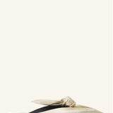 Right side view of gold flat mule bow on white background, with no model shown.