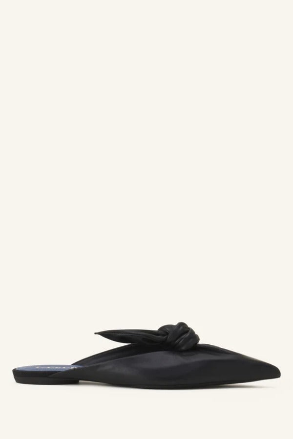 Right side view of black flat mule bow on white background, with no model shown.