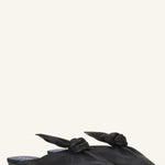 Pair view of black flat mule bow on white background, with no model shown.