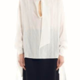 Front view of Ecru Scarf Blouse on model wearing black skirt, against a white background.