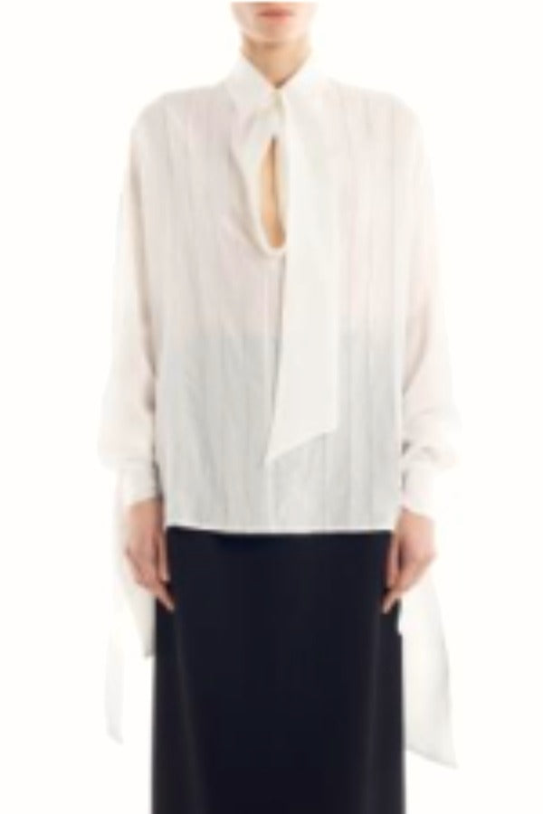 Front view of Ecru Scarf Blouse on model wearing black skirt, against a white background.