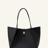 Front view of black tote bag on white background, with no model shown.