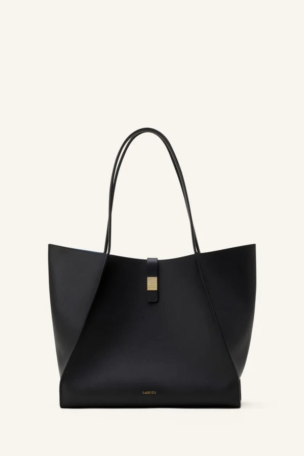 Front view of black tote bag on white background, with no model shown.