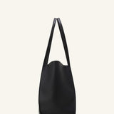 Alternate side view of black tote bag on white background, with no model shown.